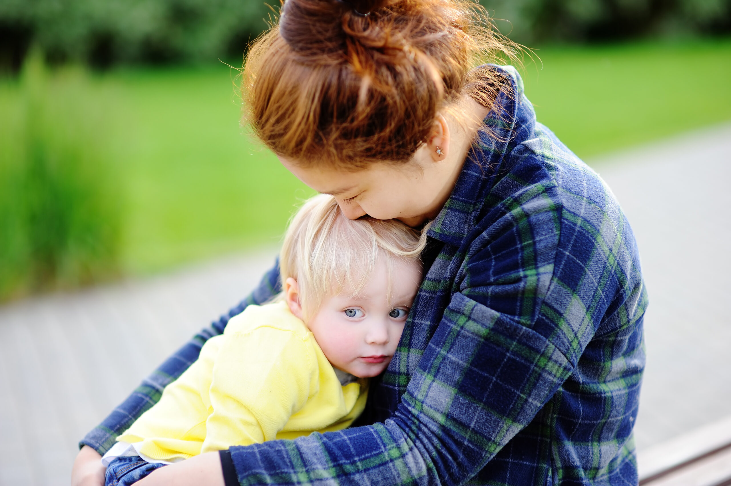 young lady comforting toddler